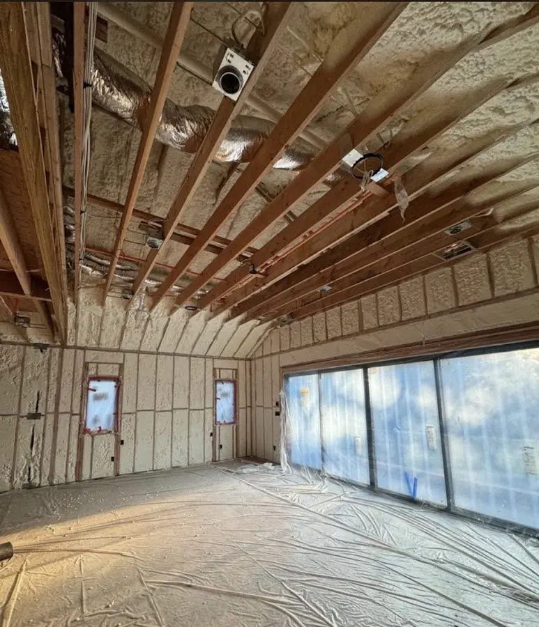 Interior walls and ceiling insulated with spray foam during new construction in Pasadena Hills